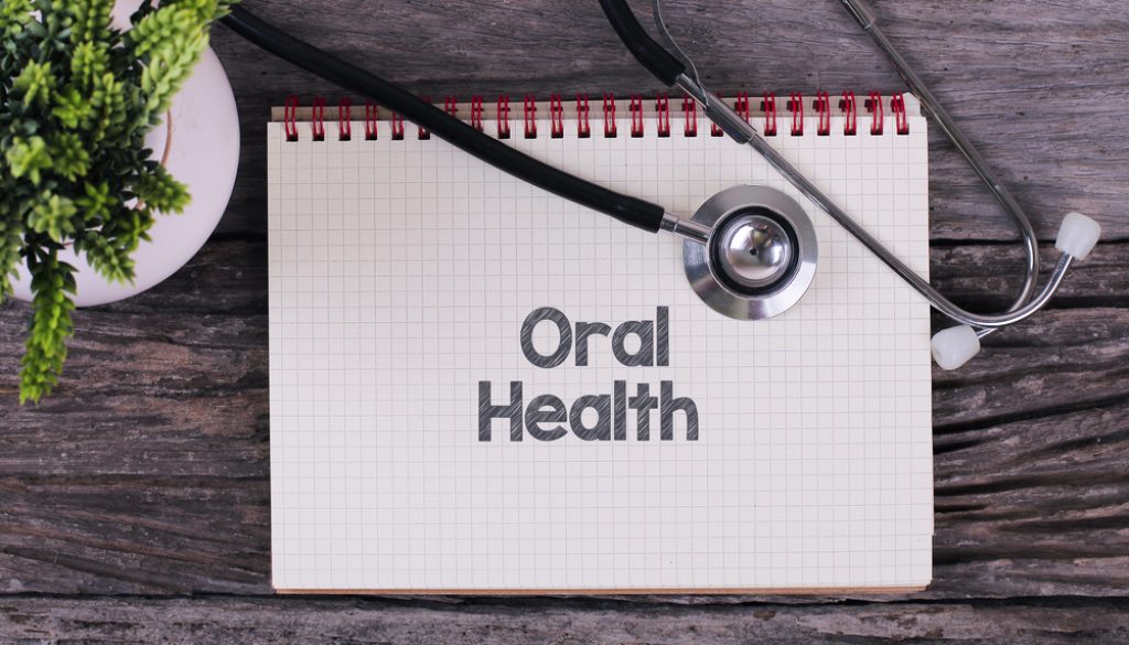 See a dentist to reduce your risk of developing chronic health conditions like diabetes and heart disease.